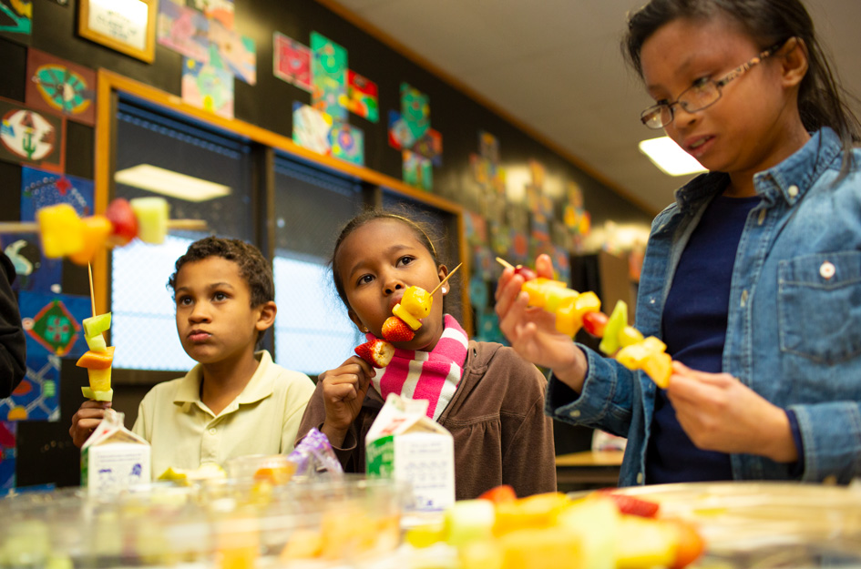 Kids with fruit sticks