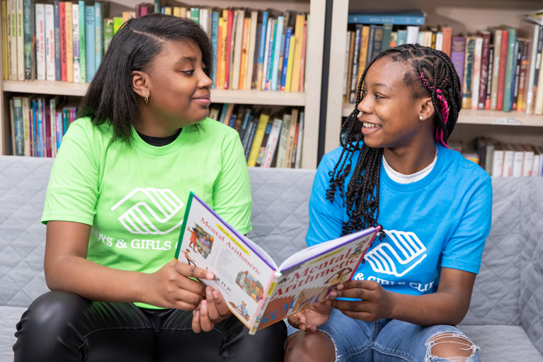 Club kids reading their books