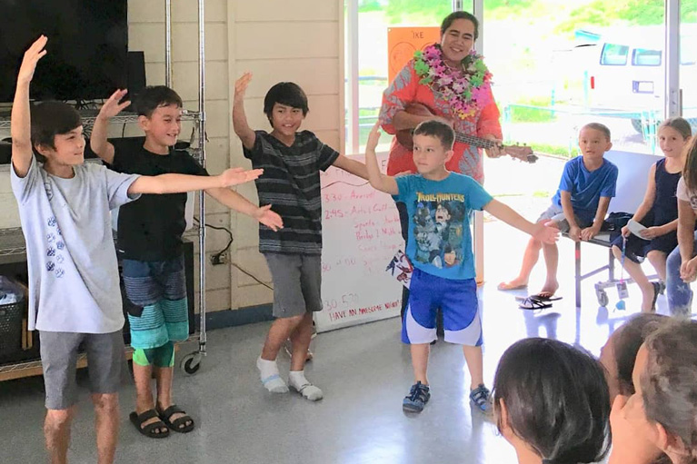 Club boys doing hula