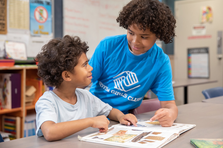 Club kids reading their books