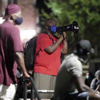 Michael Johnson with megaphone image
