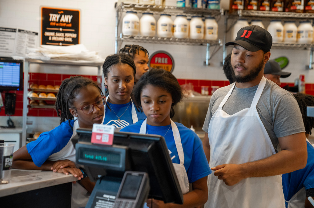 Boys &amp; Girls Club Members picture here attended a Jimmy John’s restaurant to learn about the operations of a restaurant.