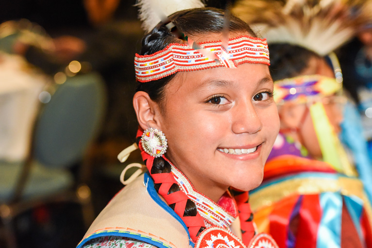 Smiling Club kid in regalia