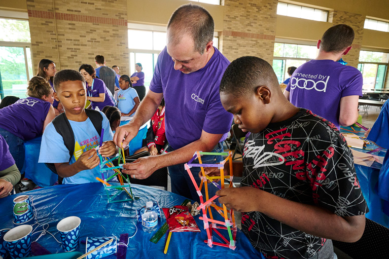 Club kids and Crown Castle volunteer