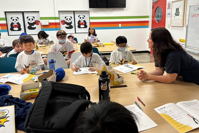 Club room with kids working on project with YDP style=