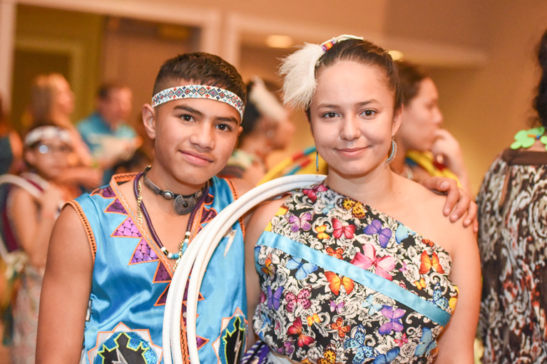 2 Native Club teens in regalia