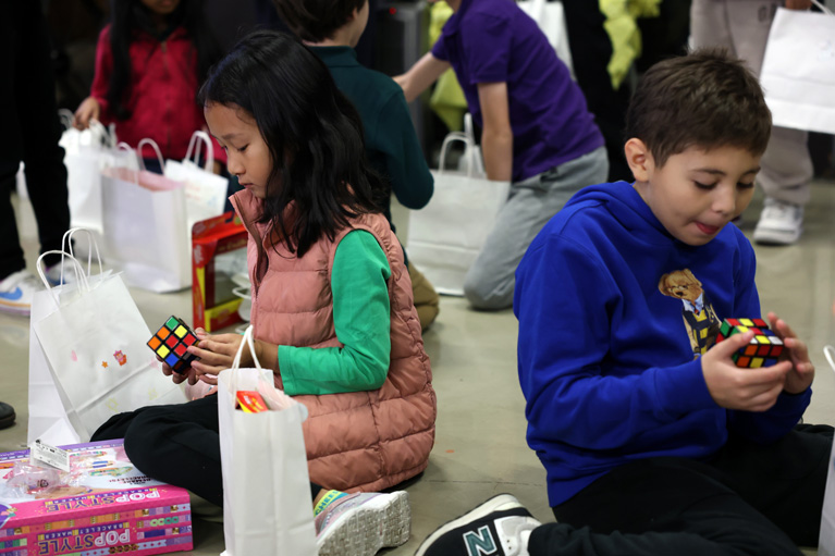 Club kids playing with Rubik's Cubes