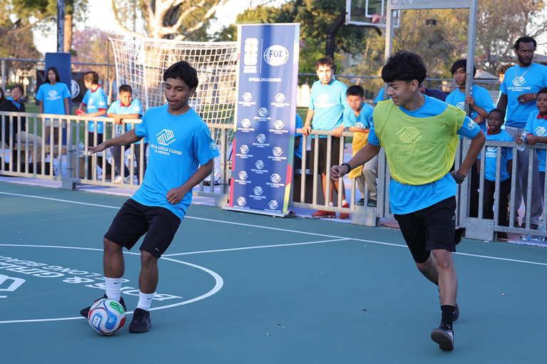 Club kids playing soccer